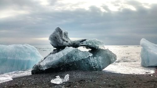 Scenic view of sea against sky during winter