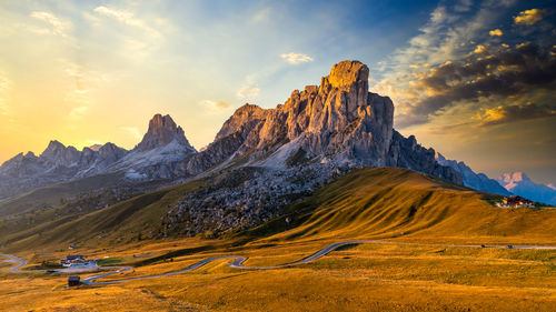 Scenic view of snowcapped mountains against sky during sunset