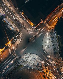 Aerial high angle view of illuminated city street at night