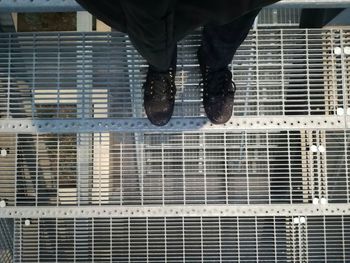 Low section of man with metal grate