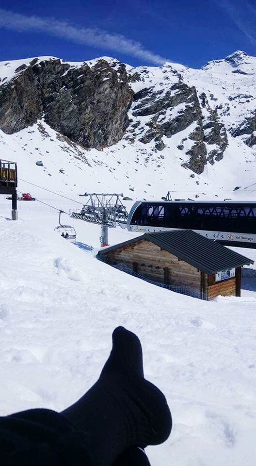 SKI LIFT OVER SNOWCAPPED MOUNTAINS AGAINST SKY