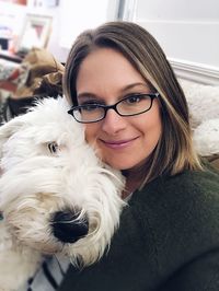 Portrait of young woman with dog