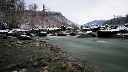 Frozen lake against sky