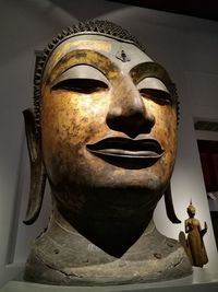 Close-up of buddha statue in museum