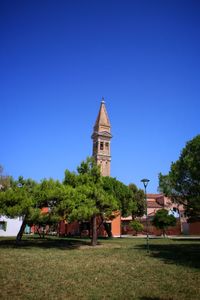 View of bell tower against blue sky