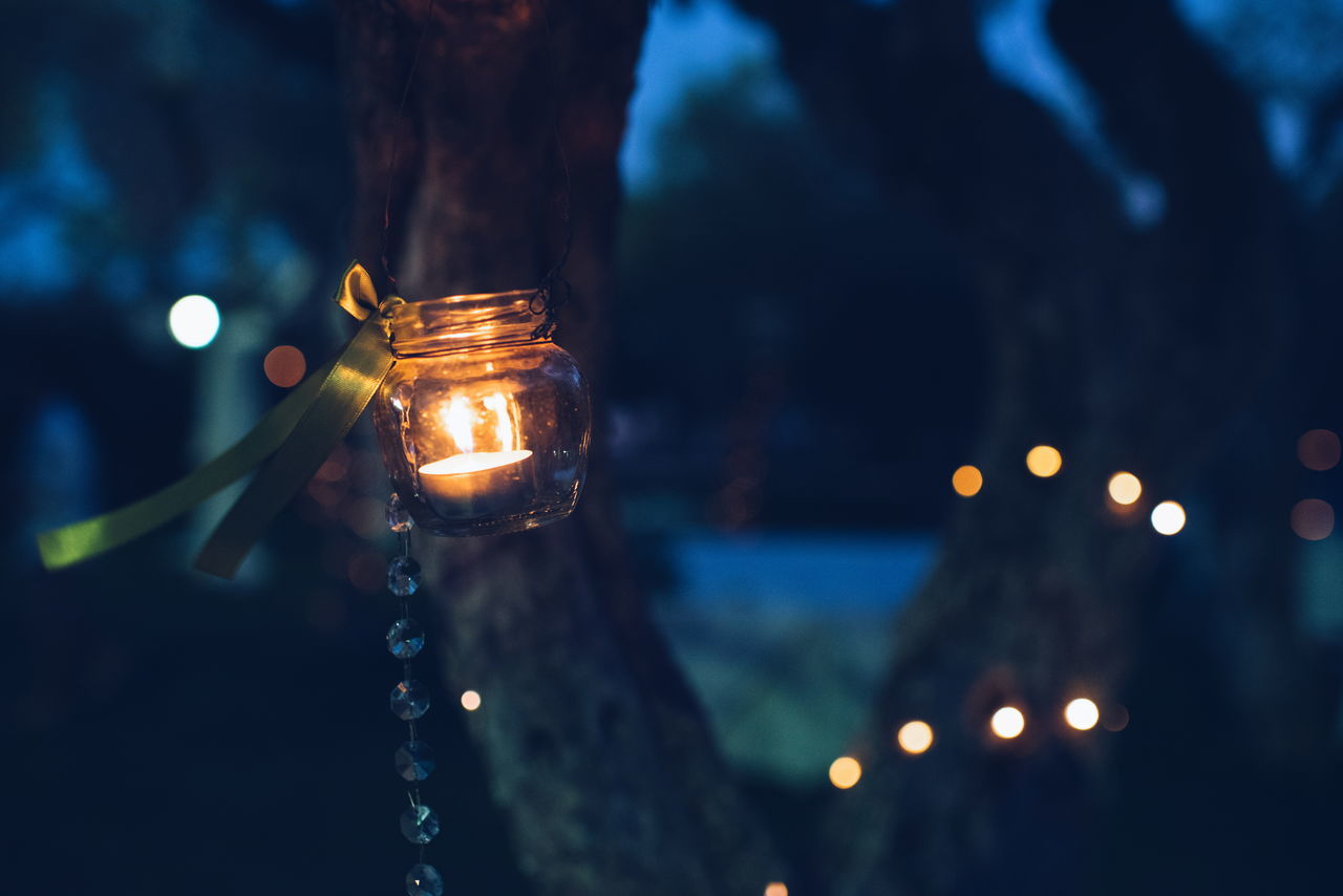 close-up, focus on foreground, illuminated, no people, night, water, outdoors, nature, sky