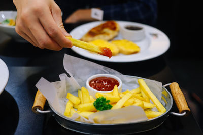 Close-up of person preparing food on table