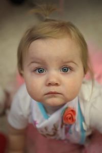 High angle portrait of cute baby girl at home