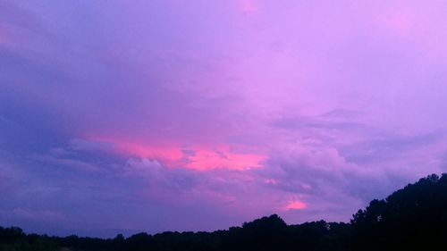 Silhouette of landscape against dramatic sky