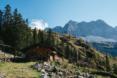 Scenic view of mountains and trees against sky