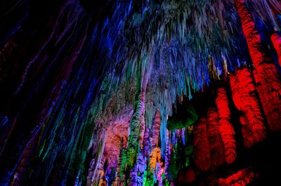 Low angle view of illuminated cave