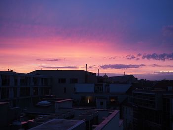 Cityscape against sky at sunset