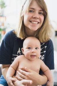 Young mother takes a walk with young baby