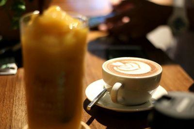 Close-up of cappuccino on table