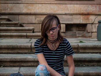 Teenage girl sitting on steps