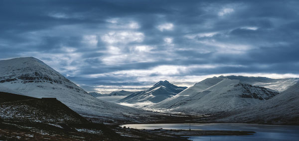 Scenic view of snowcapped mountains against sky