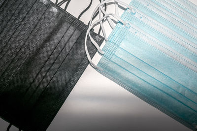 High angle view of metal grate against blue sky