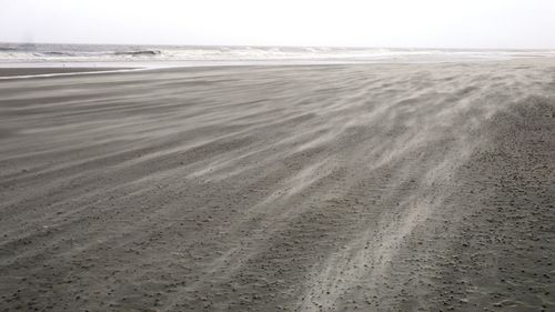 Scenic view of beach against clear sky