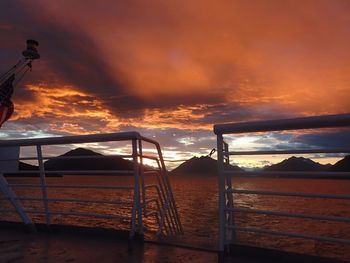 Scenic view of sea against orange sky