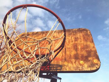 Low angle view of homemade basketball hoop against sky