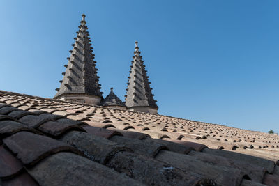 Low angle view of roof against blue sky