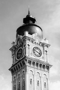 Low angle view of clock tower against sky