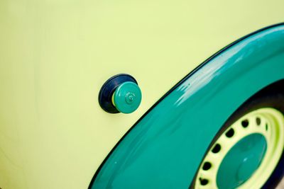 Close-up of green and yellow car