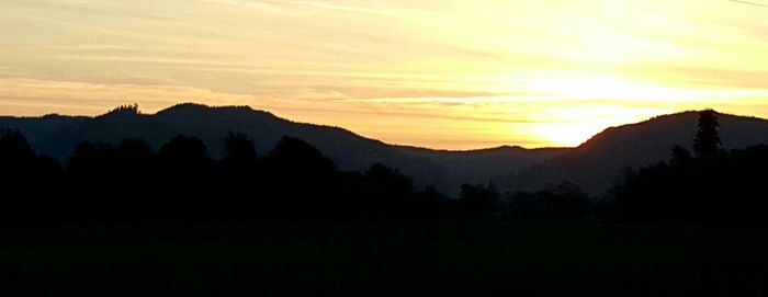 Scenic view of mountains at sunset