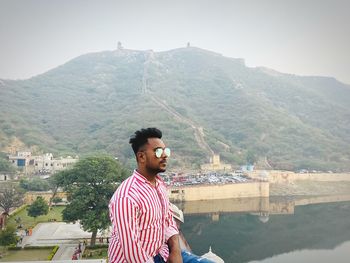 Young man standing on mountain