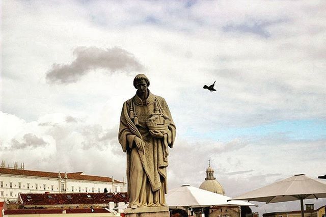 statue, human representation, sculpture, art and craft, sky, art, cloud - sky, creativity, low angle view, cloudy, cloud, built structure, architecture, building exterior, travel destinations, travel, day, religion