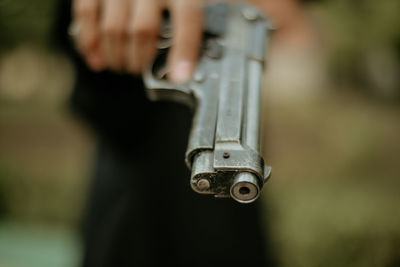 Close-up of person holding camera