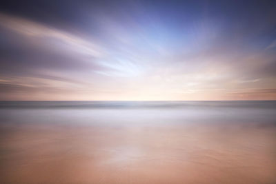 Scenic view of sea against sky at sunset