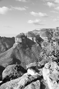 Rock formations on landscape against sky