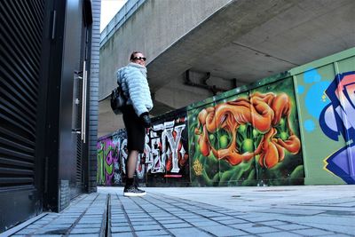 Man on footpath in city