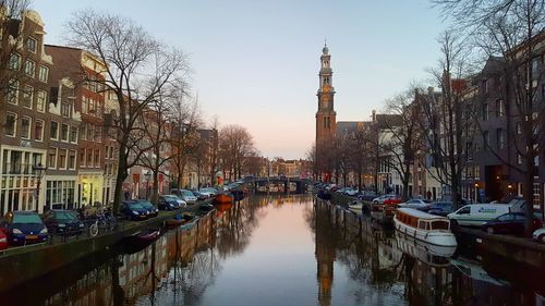 Canal passing through city buildings