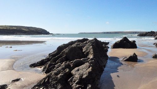 Scenic view of sea against clear blue sky