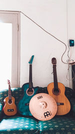 Electric guitar on wall at home