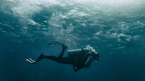 Person scuba diving undersea