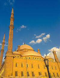 Low angle view of building against blue sky