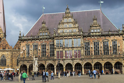 Group of people in front of historic building