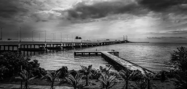 Pier over sea against sky