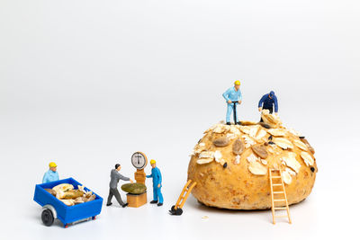 Close-up of figurines against white background