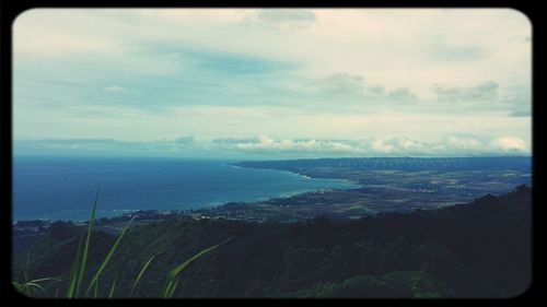 Scenic view of sea against cloudy sky