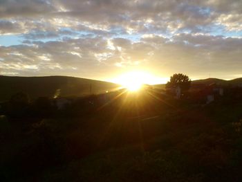 Scenic view of landscape against sky during sunset