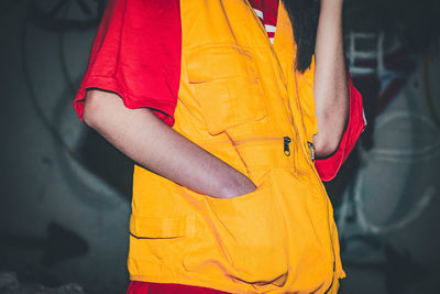 Rear view of woman with yellow umbrella