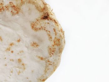 High angle view of bread against white background