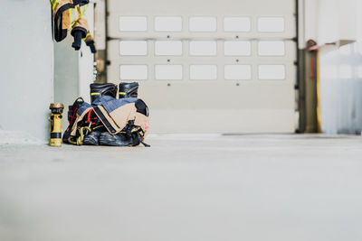 Close-up of motorcycle on floor against wall