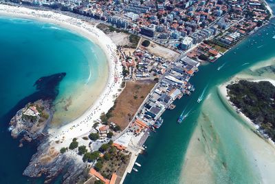 High angle view of city by sea