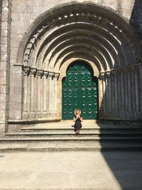Full length of woman walking in historical building
