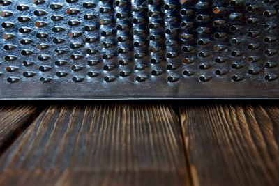 Full frame shot of metallic container on table
